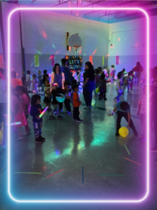 a group of people standing around with LED lights